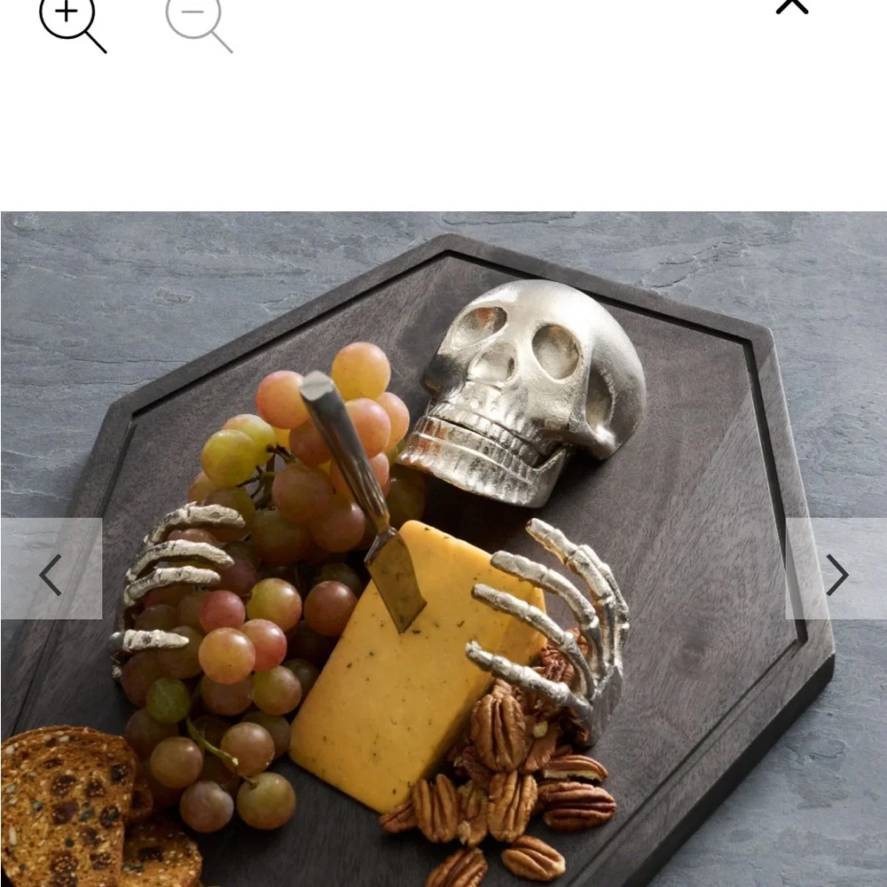 Skeleton on Dark Brown Coffin charcuterie board by Pottery Barn